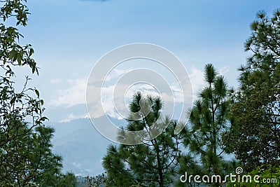 White clouds over distant Himalayan mountains, monsoon landscape of Himalays,Garhwal, Uttarakhand, India. Climate change effect on Stock Photo