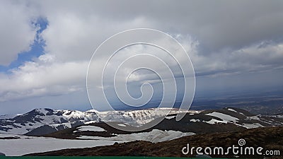 White clouds, plateau covered with snow Stock Photo