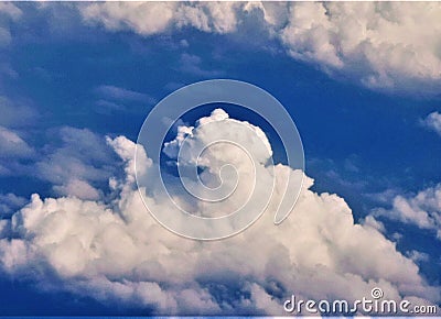 White clouds in the sky, a white sheep swam in the clouds Stock Photo