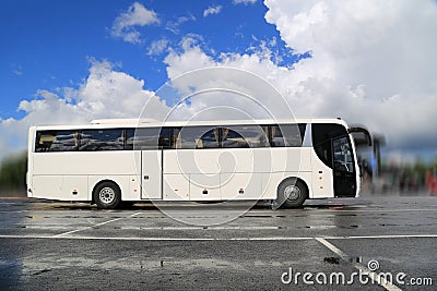 White Coach Bus Waits for Passengers on Foggy Rainy Morning Editorial Stock Photo