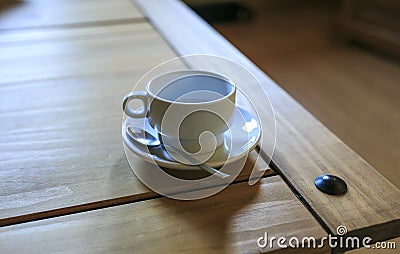 White Cofee cup in a wooden table Stock Photo
