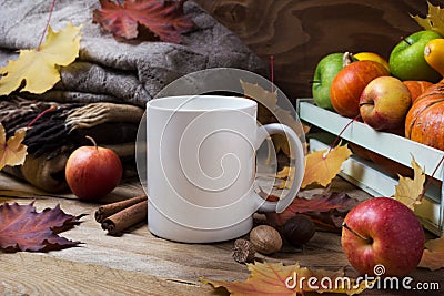 White coffee mug mockup with fall leaves and knitted plaid Stock Photo