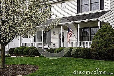 White colonial house with white picket fence Stock Photo