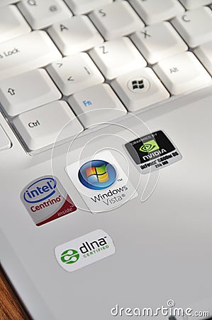 A white color laptop and Q keyboard detail, Windows Vista and brands Editorial Stock Photo