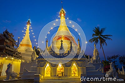 A white color of pagoda decorated by lighting at night time Stock Photo