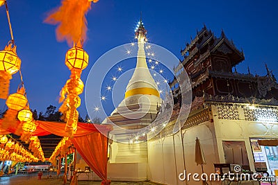 A white color of pagoda decorated by lighting at night time Stock Photo