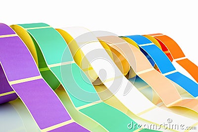 White and colored label rolls isolated on white background with shadow reflection. Color reels of labels for printers. Stock Photo