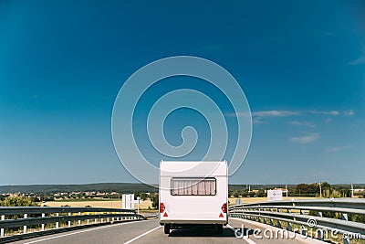 White Colour Motorhome Car Goes On Motorway Road Stock Photo
