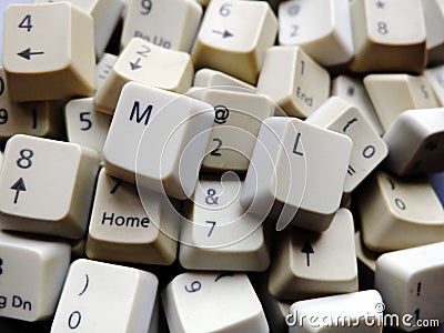 White computer keyboard keys, mostly numeric with ML Machine learning buttons at the front. Concept of unstructured big data Stock Photo
