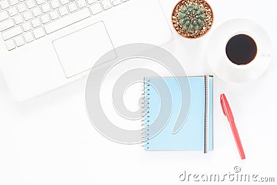 White computer laptop with coffee cup, notebook and cactus Stock Photo