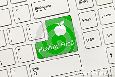 White conceptual keyboard - Healthy Food green key with apple s Stock Photo