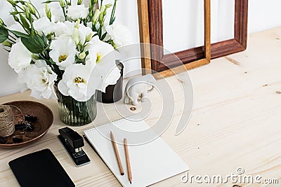 White contemporary feminine work desk with flowers Stock Photo