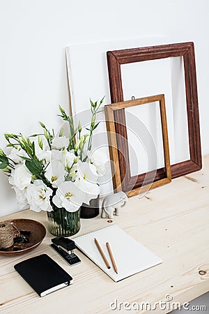 White contemporary feminine work desk with flowers Stock Photo