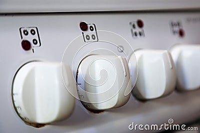 White cooker buttons in a row with numbers Stock Photo