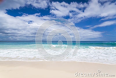 White coral beach sand and azure indian ocean. Stock Photo