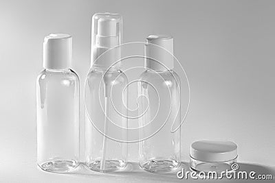 White cosmetic bottles on white background. Wellness, spa and body care bottles collection. Beauty treatment Stock Photo