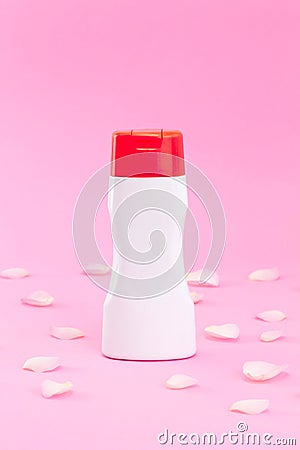 White cosmetic plastic bottle or container product for gel, lotion, cream, branding mock up on pink background with rose petal, Stock Photo