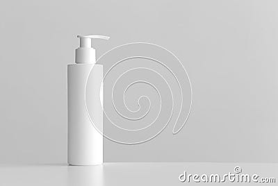 White cosmetic shampoo dispenser bottle mockup with blank copy space on a white table Stock Photo