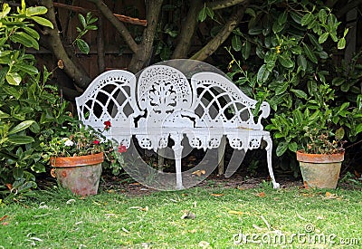 White cottage garden love seat Stock Photo