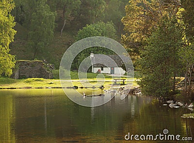 White Cottage on Lake, Scotland Stock Photo