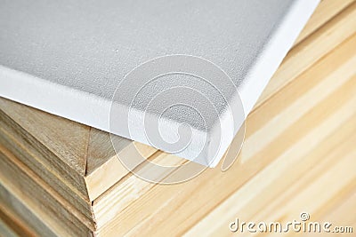 White cotton canvas. Wooden stretchers in the background. Select Stock Photo