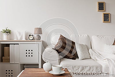 White couch and commode Stock Photo