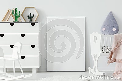 White cradle and rocking horse in bright baby`s room interior wi Stock Photo