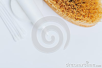 White cream tube and cotton pads and wands, cactus fiber brush Stock Photo