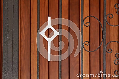 White cross on a metallic door Stock Photo