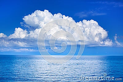 White cumulus clouds in blue sky over sea landscape, big cloud above ocean water panorama, seascape panoramic view, cloudy weather Stock Photo