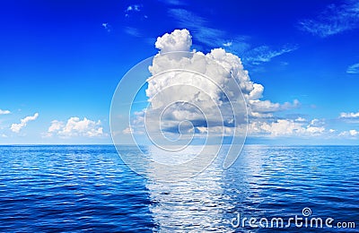 White cumulus clouds in blue sky over sea landscape, big cloud reflection on water above ocean panorama, scenic tropical seascape Stock Photo