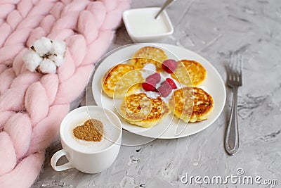 White Cup of Coffee Cappuccino with Heart Pattern of Cinnamon, Cottage Cheese Pancakes with Raspberries Stock Photo