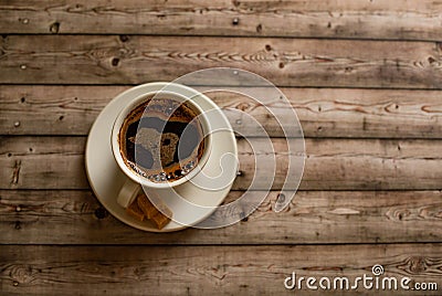 White Cup of coffee on wood natural background cane sugar pieces on plat Stock Photo