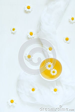 White cup of natural dried chamomile tea with Stock Photo