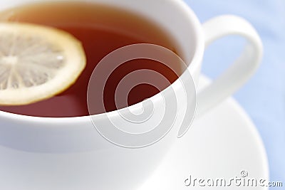 White cup of tea with lemon Stock Photo