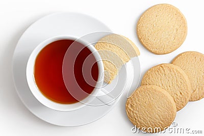 White cup of tea and saucer with shortbread biscuits from above. Stock Photo