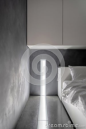 White cupboards and bed in modern bedroom Stock Photo