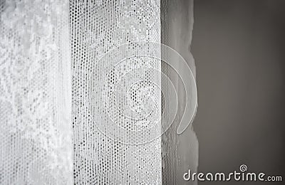 White curtain decorated with sewed floral pattern in lace Stock Photo