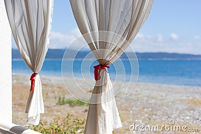 White curtains against the sea Stock Photo