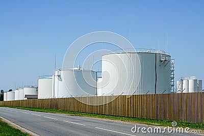 White cylindrical storage tanks for petroleum products Stock Photo