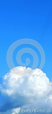 White and dense cloud like cotton against clean and blue sky Stock Photo