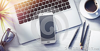 Top view of a white desktop with laptop and office accesoires Stock Photo