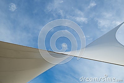 White detail of big top tent against a blue an cloudy sky Stock Photo