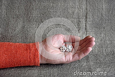 White dices on the male palm. Board games Stock Photo