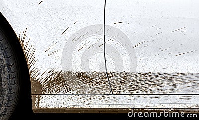 White dirty car stained of the swamp the driver door and the front fender. Stock Photo