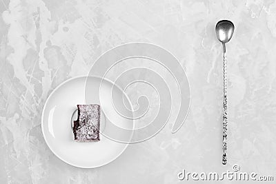 White dish with fruit candy and antique silver spoon Stock Photo