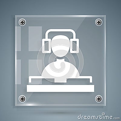 White DJ wearing headphones in front of record decks icon isolated on grey background. DJ playing music. Square glass Vector Illustration