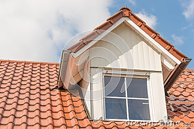 Dormer window with metal cladding in wood look Stock Photo