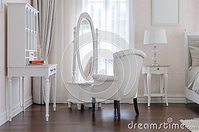 white dressing table with classic chair aand elegance mirror in Stock Photo