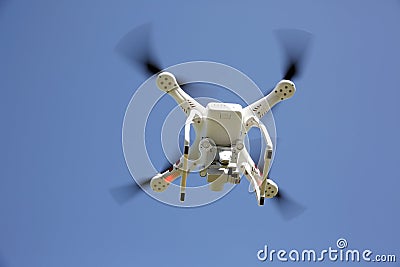 White drone with clear blue sky Stock Photo